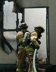 FF's fighting fire in doorway