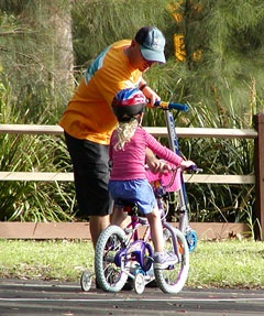 Photo of girl on bike in park